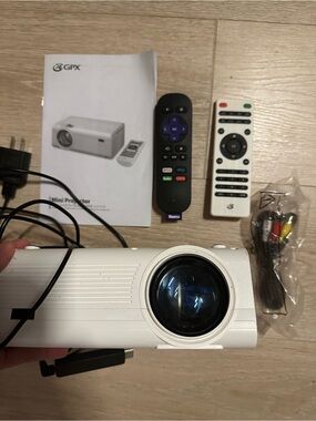 GPX White Mini Projector with ROKU Stick and Remote Control